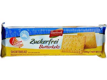 Butterkeks sans sucre 3300. Ingrédients : farine de blé, édulcorants (maltitol, isomalt, érythrol), beurre (10%) (lait), amidon de blé, inuline (fibre de chicorée), sel, arôme naturel, poudres à lever (bicarbonate d'ammonium, bicarbonate de sodium). ), 
						émulsifiant (lécithine de soja), régulateur d'acidité acide citrique, colorant (carotènes). Allergènes : contient du soja, du blé, du lait ; peut contenir des œufs et des noix.